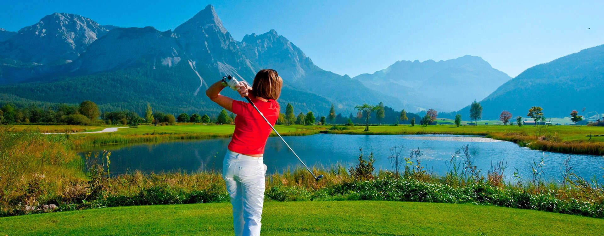 Golf tee off in Tyrol